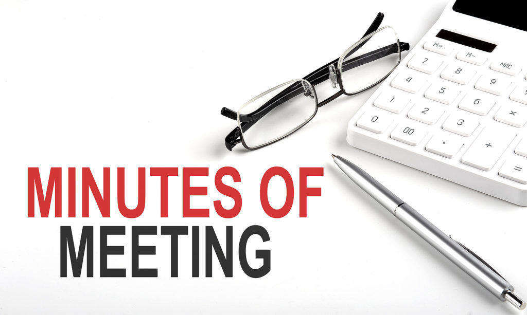 MINUTES OF MEETING Concept. Calculator,pen and glasses on the white background