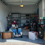 Orlando, FL USA - March 3, 2022: An unorganized garage filled with a lot of stuff in a neighborhood.
