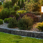 Modern Outdoor LED Garden Lighting Inside Beautiful Mature Residential Backyard. Gardening and Landscaping Theme.
